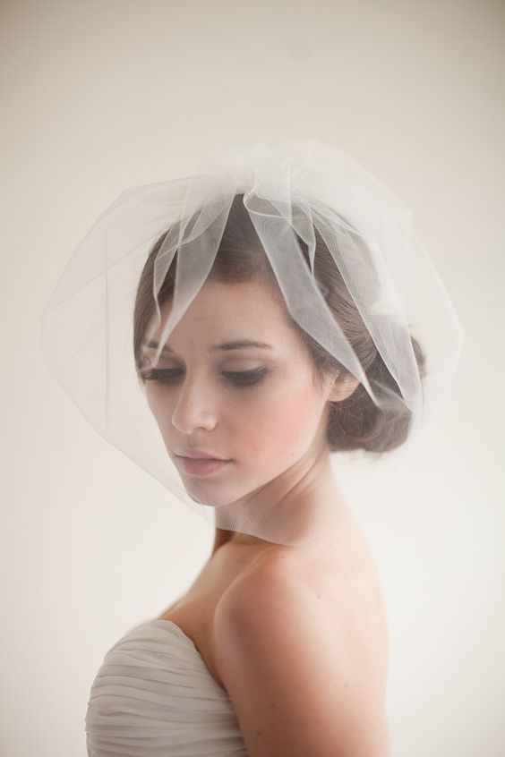  Light and short veils cover half of the face. These veils can be part of a hat or a beautiful hair clip, or an independent veil can be attached to hair using hairpins. | www.rossiniweddings.com