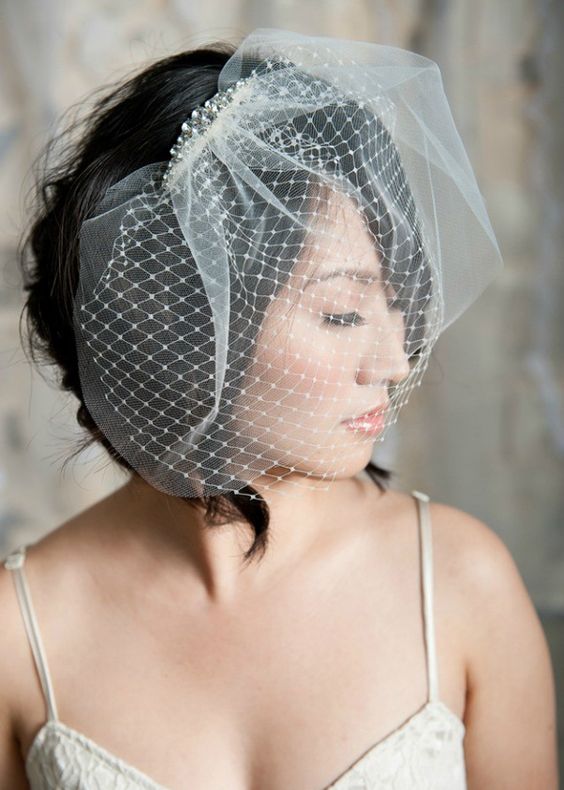 Birdcage Veil - Light and short veils cover half of the face. These veils can be part of a hat or a beautiful hair clip, or an independent veil can be attached to hair using hairpins. | www.rossiniweddings.com