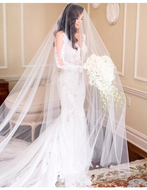 Cathedral Veil - These statement pieces not only reach the very bottom of the dress, but stretch further out to form a long train.  | www.rossiniweddings.com