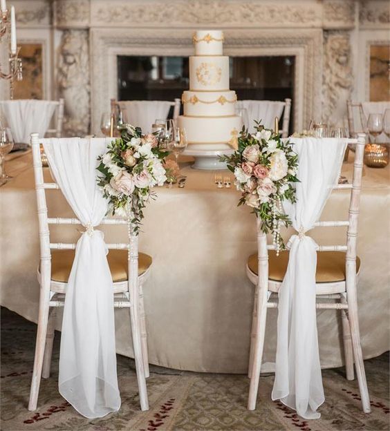 Decorate the back of your chiavari chair with soft fabric and florals
